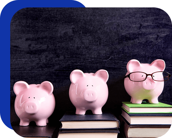 Three pink piggy banks sitting on top of books.