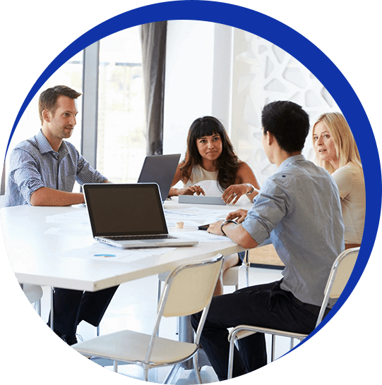 A group of people sitting around a table.